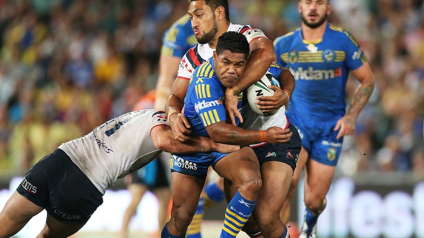 Chris Sandow is tackled