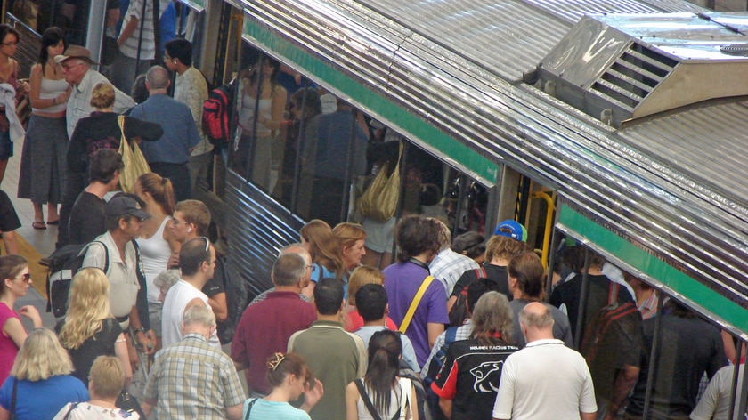 Generic shot of passengers waiting to get onto a train