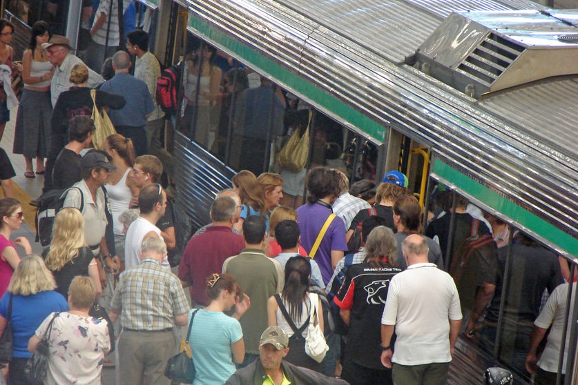 Generic shot of passengers waiting to get onto a train