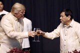 US President Donald Trump toasts with Philippines President Rodrigo Duterte