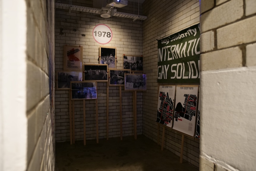 An old jail cell covered in old posters