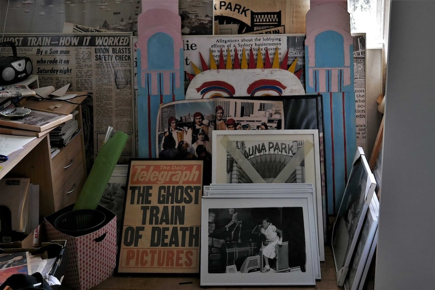 Room of framed photos of Luna Park and newspaper headlines about the fire.