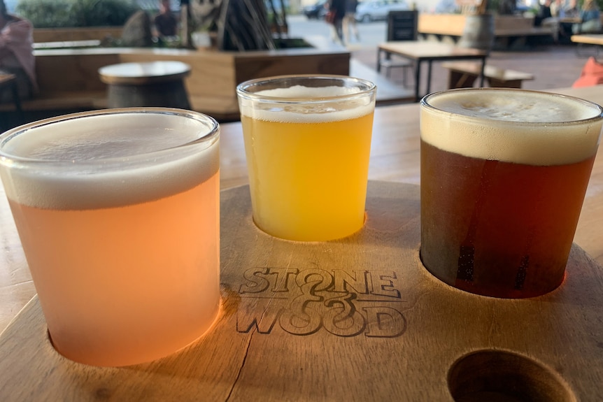 A tasting paddle of three small beers.