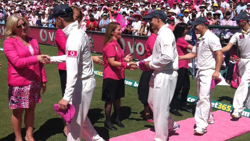Day of pink ... the Australian Test team partakes in a pink carpet ceremony on Jane McGrath Day.