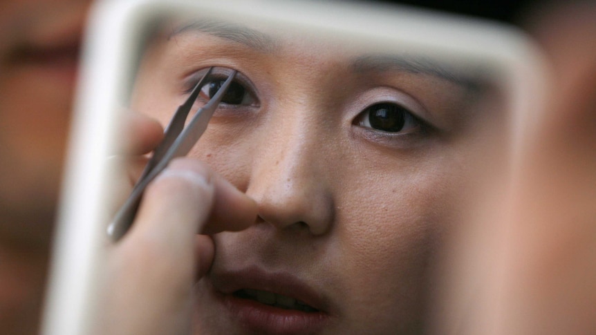 Korean plastic surgeon Kim Byung-gun demonstrates the so-called "double eyelid surgery".