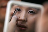Korean plastic surgeon Kim Byung-gun demonstrates the so-called "double eyelid surgery".