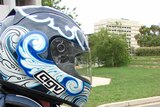 Close-up of motorcyclist wearing helmet - generic