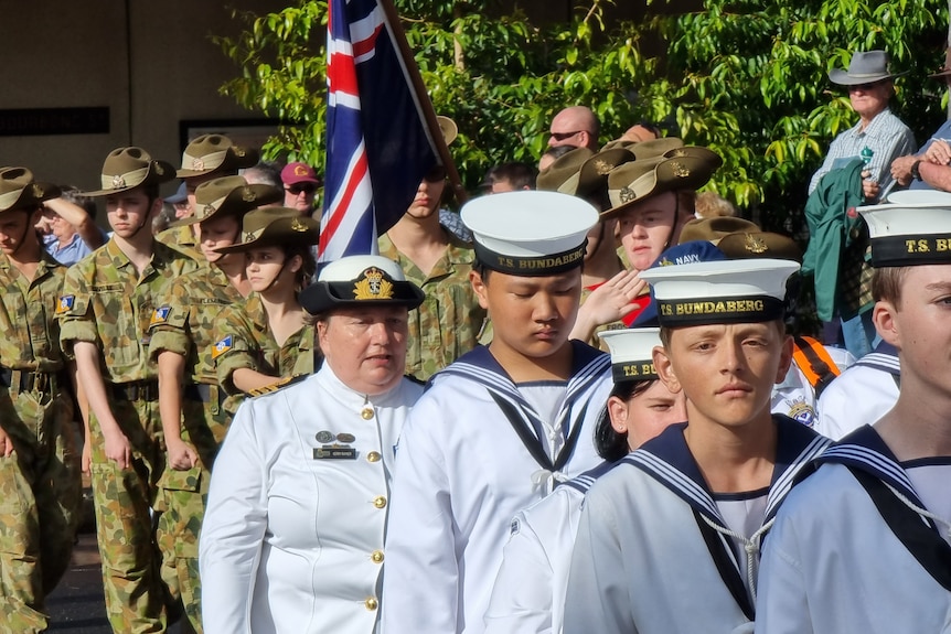 Navy and Army personnel attend the Anzac day march and service in Bundaberg CBD.