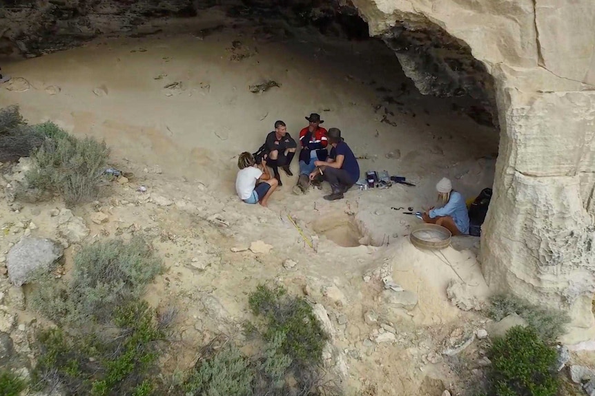 Researchers, Aboriginal elders and filmmakers excavating artefacts from old cave systems on Salisbury Island.
