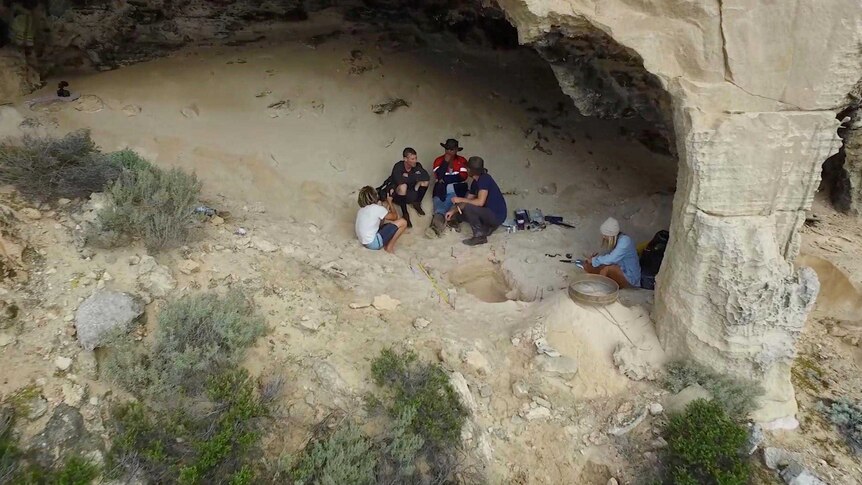 Researchers, Aboriginal elders and filmmakers excavating artefacts from old cave systems on Salisbury Island.