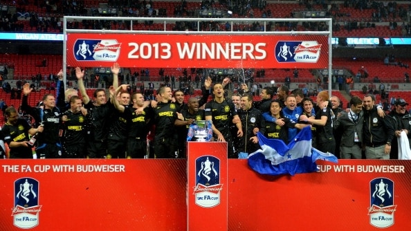 Wigan players celebrate winning the FA Cup