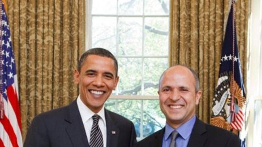 Louie Eroglu with US president Barack Obama after winning the video photographer of the year award.