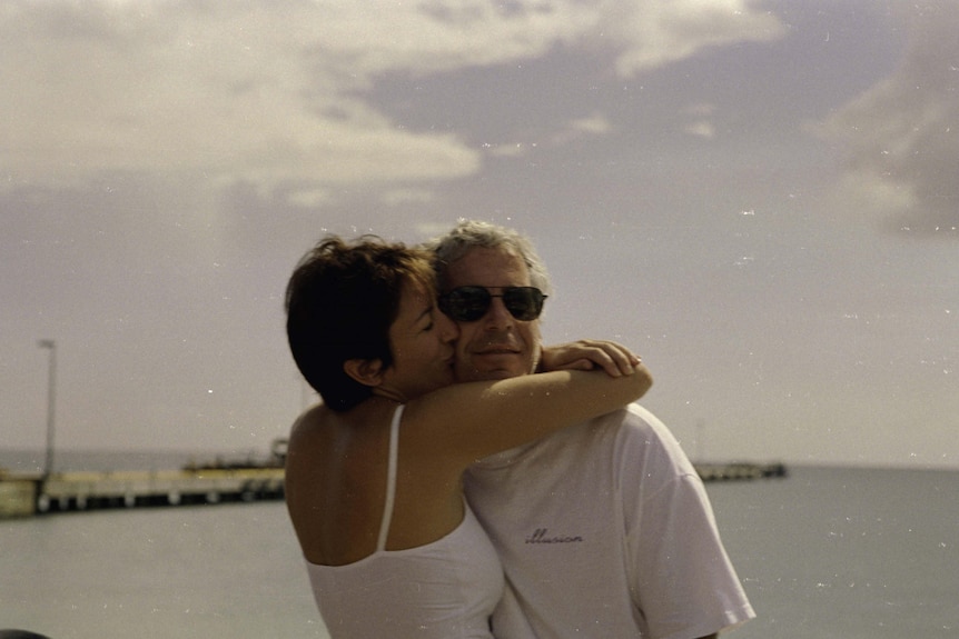 Ghislaine Maxwell wraps her arms around Jeffrey Epstein's necks and kisses his cheek 