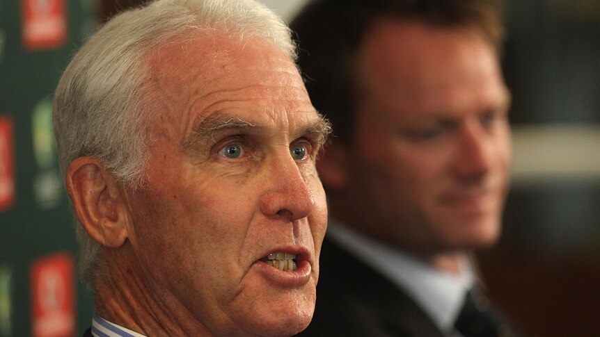 John Inverarity at press conference with out of focus Pat Howard