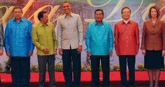 Leaders smile and stand in a line at ASEAN.