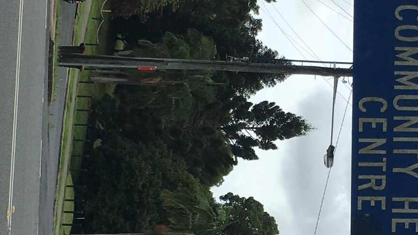A pole with street signs on it