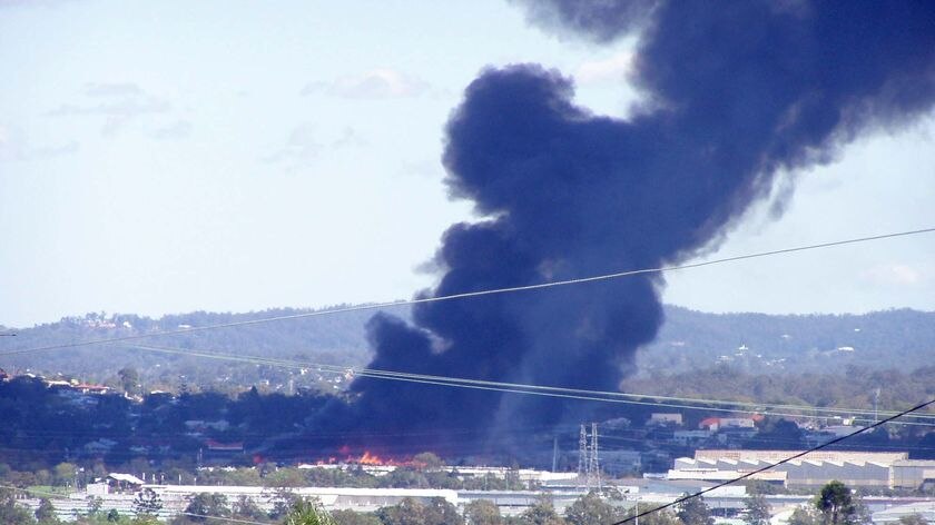 Smoke billows from the warehouse fire in the Brisbane suburb of Sherwood