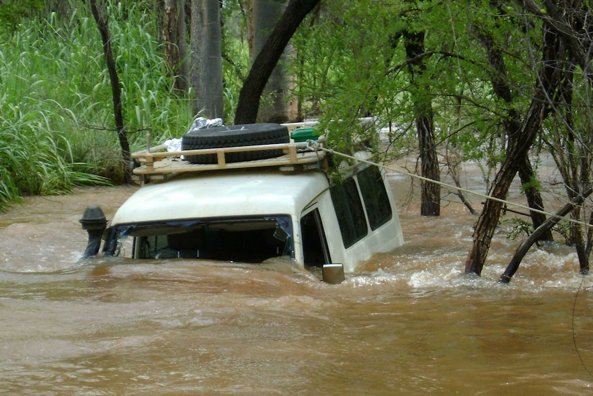 Police car being swept away by floodwaters at Smoke Creek, WA
