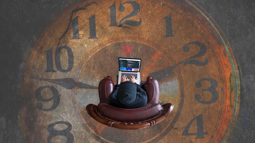 A person sits in the middle of a clock on their computer.