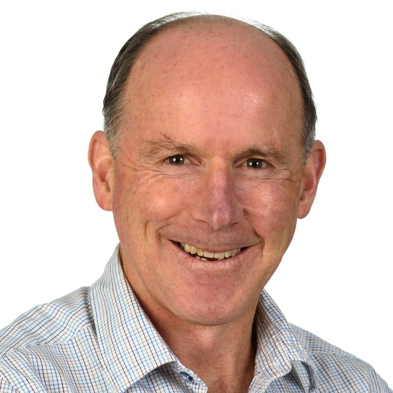 Tim Driscoll smiling wearing a checked shirt