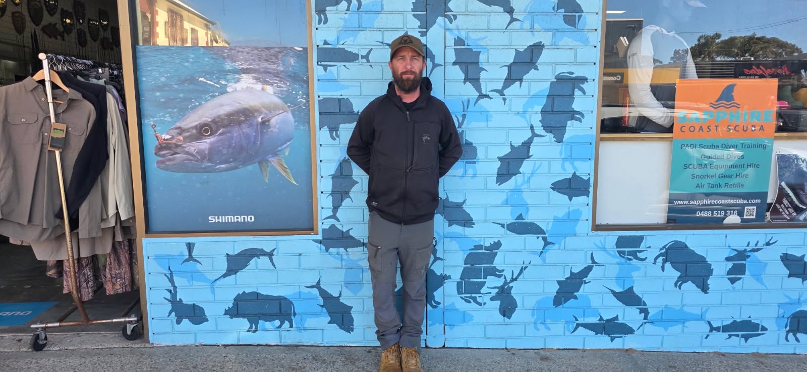 Person standing next to wall