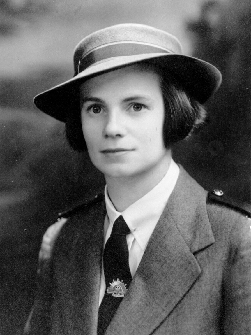 A black and white shot of a young servicewoman.
