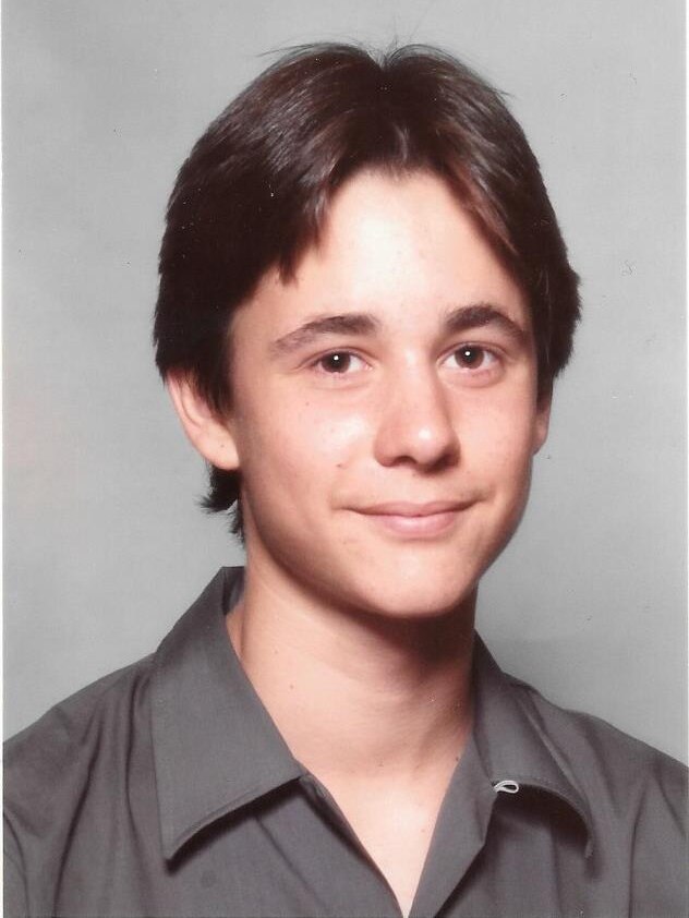 A portrait of Jarrod from a school photo shoot, wearing a uniform.
