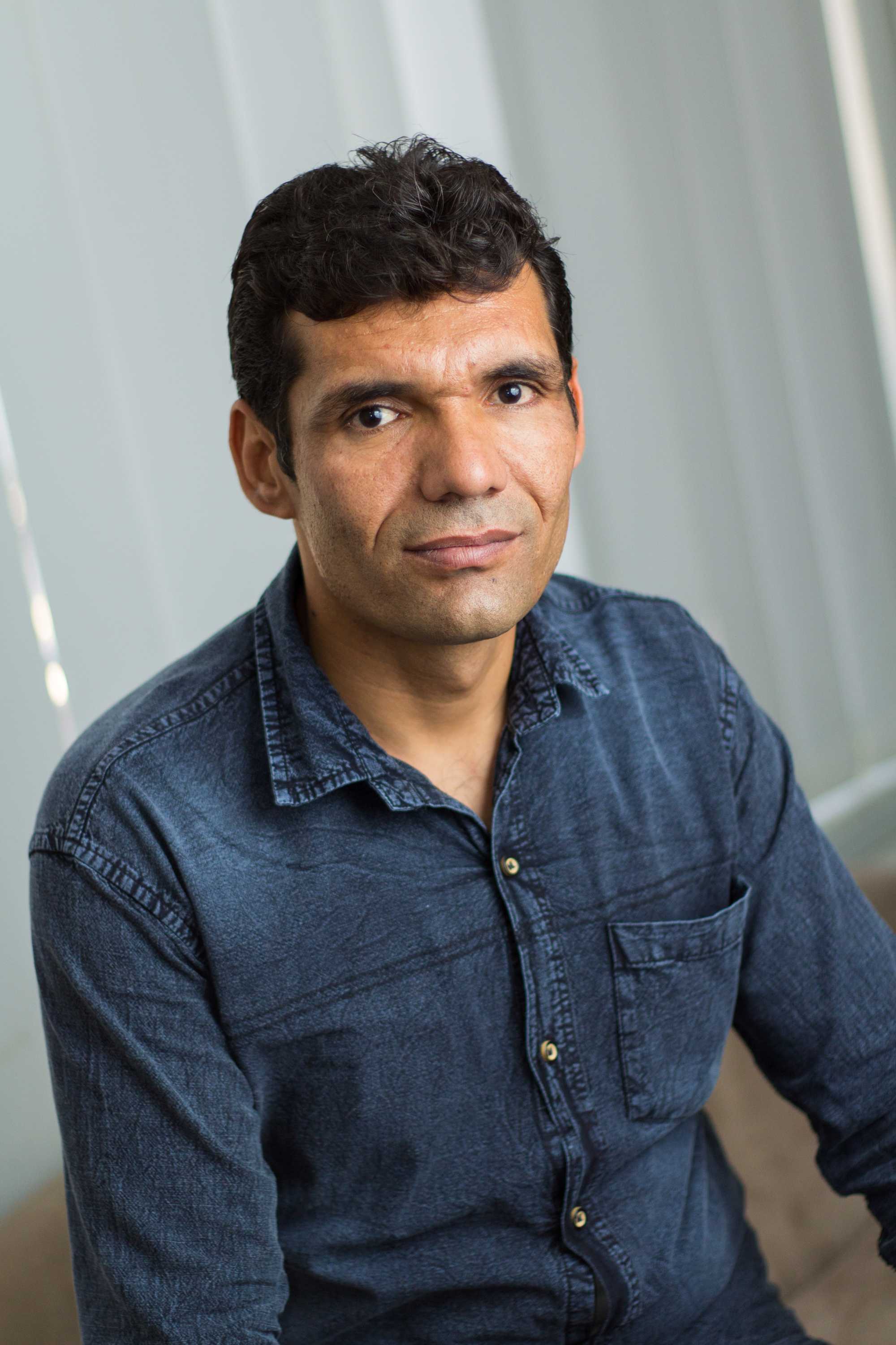 Jan Bismillah sits on a lounge.