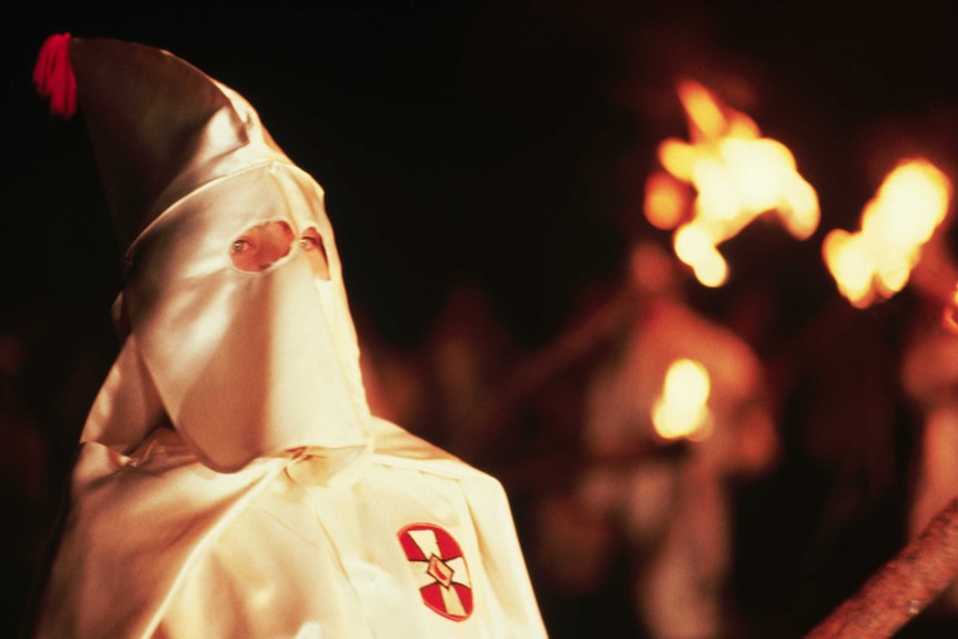 A member of the Ku Klux Klan is pictured at a rally in Maryland.