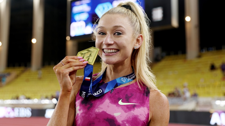 Jessica Hull with a medal after breaking world 2,000 metres record at Monaco Diamond League meet.