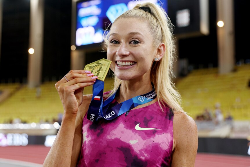 Jessica Hull with a medal after breaking world 2,000 metres record at Monaco Diamond League meet.
