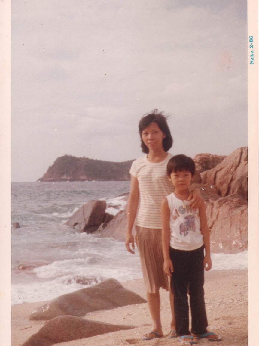 Chi Lam and his mother at a refugee camp after their escape from Vietnam.