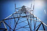 High tension power line towers at dusk