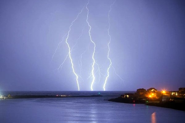 Lightning strikes across a purple sky south of Perth.