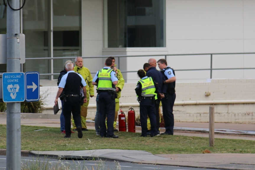 A man is handcuffed at the Phillip BP petrol station.