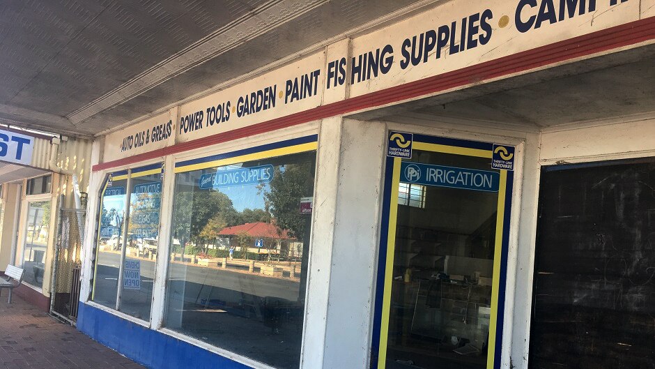 A row of shops in disrepair, one that sells irrigation equipment, in Dirranbandi.