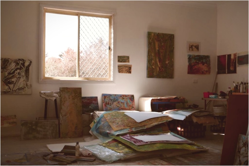 A pile of artworks in Barbara McKay's studio.