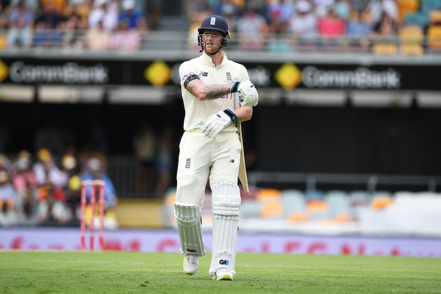 England batsman Ben Stokes leaves the field after his dismissal by Australian bowler Pat Cummins