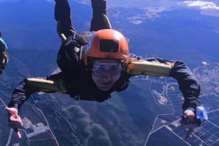 A young man skydiving
