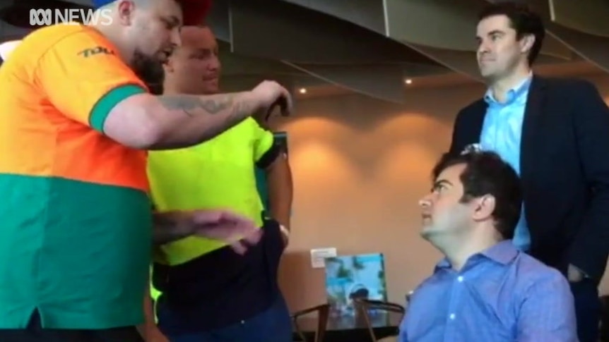Labor senator Sam Dastyari is abused by a group of men in a Melbourne pub