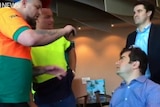 Labor senator Sam Dastyari is abused by a group of men in a Melbourne pub