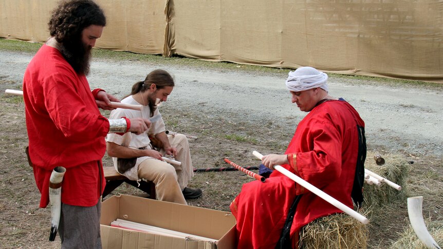 Squires prepare the balsa wood tips for the jousting poles at the Abbey Medieval Festival in Caboolture on July 7, 2012.