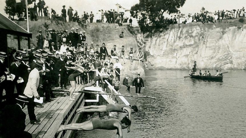 Swimmers dive into the water at Surrey Dive in the 1900s.