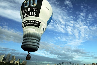 An Earth Hour light-bulb-shaped hot air balloon takes flight over Sydney Harbour