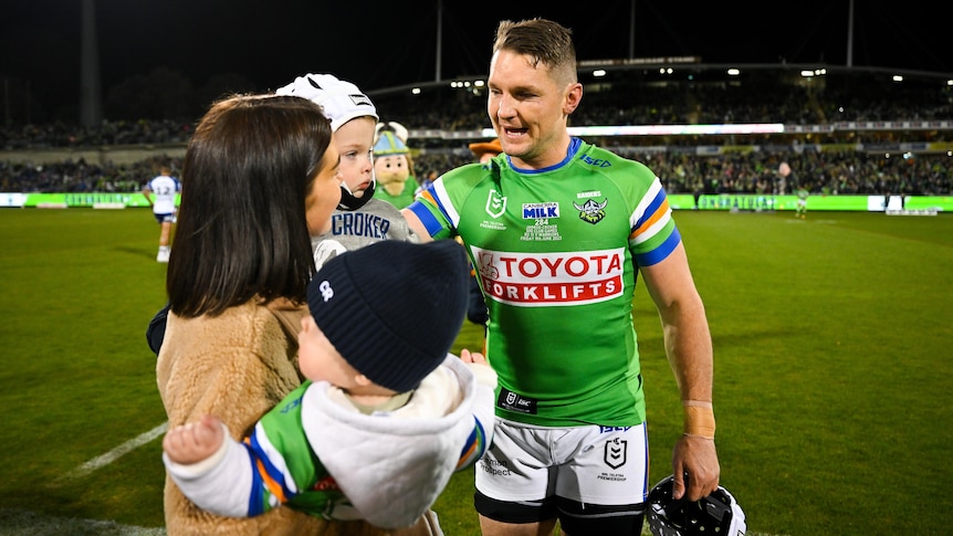 Canberra Raiders NRL player Jarrod Croker with his partner and two children before a match.