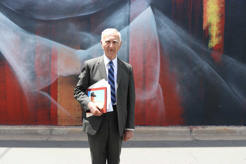 Uncle Alf (Boydie) Turner in front of the William Cooper mural in Shepparton