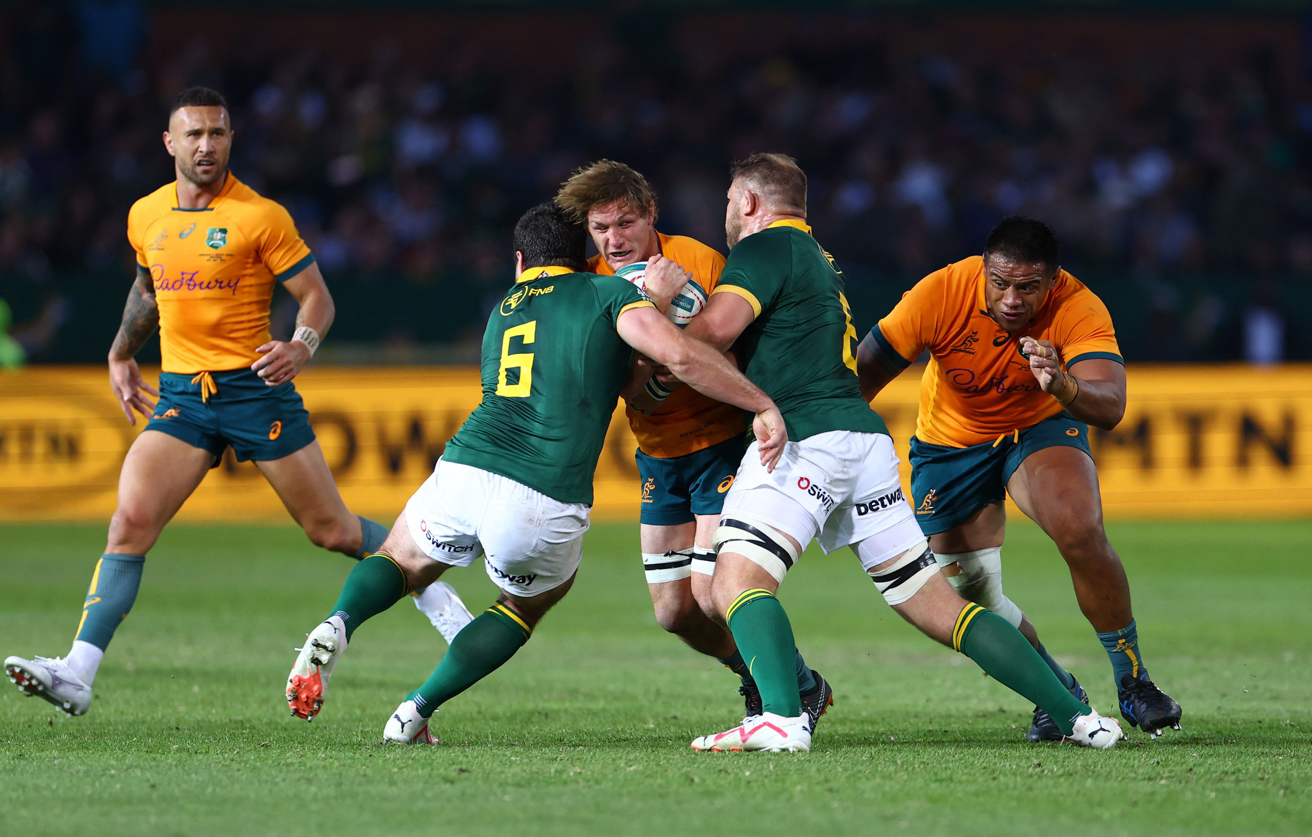 Michael Hooper is tackled