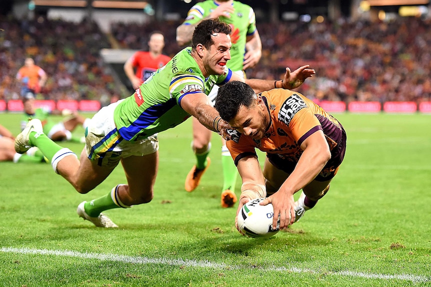 Brisbane Broncos Jordan Kahu dives across the tryline to score