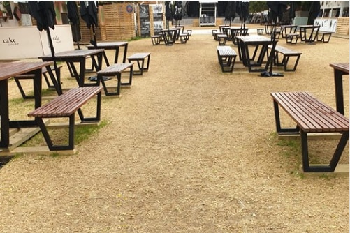 Dead grass surrounds tables at the University of Adelaide.