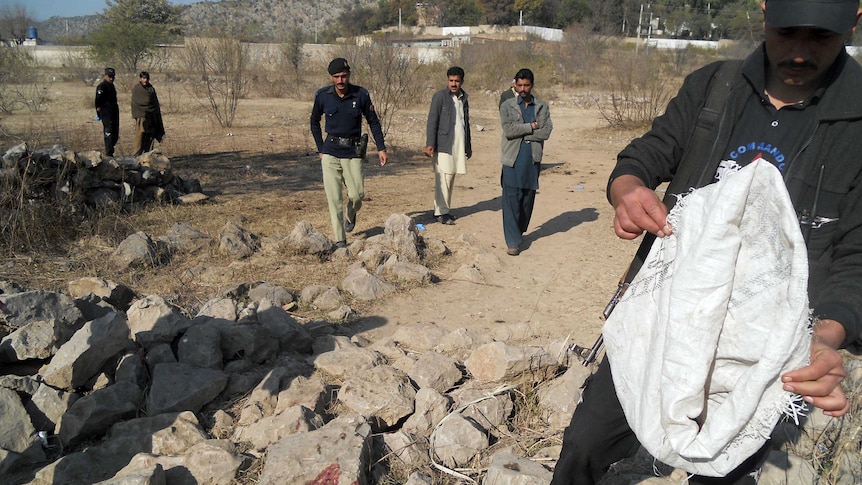 Pakistani security personnel examine the site of a suicide bombing in the Ibrahimzai area of Hangu district.